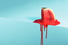 Melting Watermelon Slice On Blue Background With Space For Text. Creative Summer Composition.