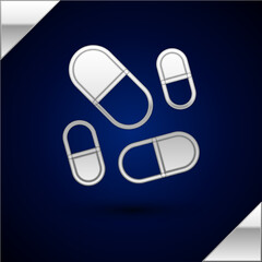 Poster - Silver Vitamin complex of pill capsule icon isolated on dark blue background. Healthy lifestyle. Vector