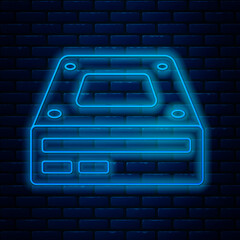 Poster - Glowing neon line Optical disc drive icon isolated on brick wall background. CD DVD laptop tray drive for read and write data disc. Vector