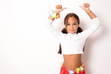 little child girl in hawaiian costume showing thumbs up isolated white background