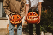 Funny Halloween Pumpkins In Hands