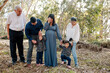 © Erin Brant/Stocksy - Multigenerational family in forest