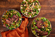 © Joe St.Pierre Photography/Stocksy - Salads with Chicken and Beef