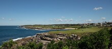 View Of Cove Beach In The Sydney Suburb Of Little Bay With Headland On A Clear Day