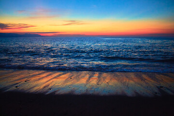 Wall Mural - beach at sunset with texture in the sand and reflections of beautiful colors in puerto vallarta jalisco 