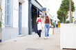 © luisrojasstock - Women walking with shopping bags in the street
