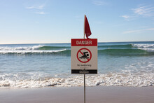 No Swimming Sign On The Beach