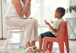 © David L/peopleimages.com - Autism, education and mental health by therapist and child learning different hand sign to express feelings in living room. Teaching, speech and child development with boy and woman lesson on emotion