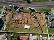© Austockphoto - Cement truck pouring house foundations