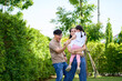 © bank215 - Happy fmaily time concept, Dad mom and daughter playing in house garden for enjoy activity together