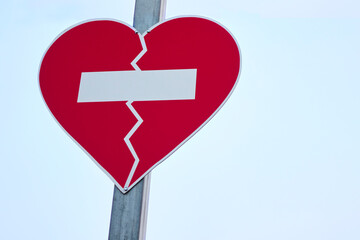 a forbidden sign in the shape of a broken heart