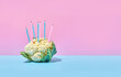Cauliflower, head of cauliflower  on a bright colored background with holiday candles. Birthday cake. Instagram concept