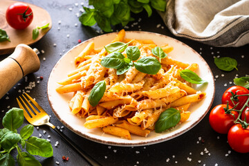 Sticker - Traditional Italian pasta with tomato sauce, basil and parmesan cheese in white plate. Close up.