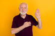 Photo of nice old man pray wear blueberry t-shirt isolated on yellow color background