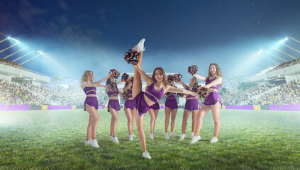 Wall Mural - Group of cheerleaders in action on  stadium in night