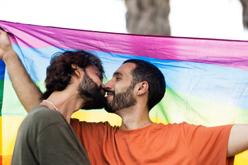 Wall Mural -  Happy couple with a pride flag. LGBT community