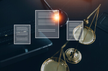 Justice and law concept.Male judge in a courtroom with the gavel, working with, computer and docking keyboard, eyeglasses, on table in morning light