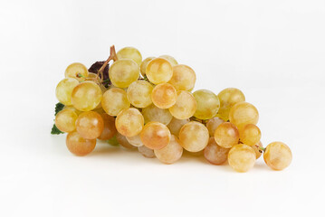 Ripe yellow grapes on a white background.