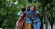 © Marco - Three happy people posing together. African ethnicity, friends smiling