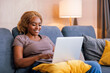 © Impact Photography - Woman surfing the net using laptop computer