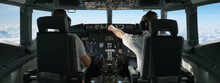 Commercial Aircraft Pilots Adjusting Flight Parameters Of The Plane During The Flight At High Altitude. View From Inside The Cabin. Real Aircraft, Daytime Shot
