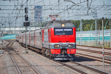 Wall Mural - Passenger train moves at autumn time.