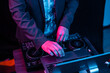 © Tim Bates - DJ playing with mixing set up