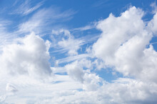 Deep Blue Sky With Mix Of Feathery Cirrus And Large Cumulus Clouds
