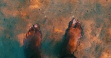 Feet Submerged In Water