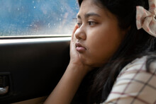 Teenage Girl Travelling In A Car With Pensive Mood