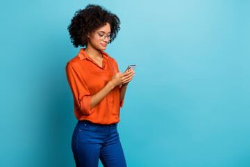 Sticker - Profile side view portrait of attractive focused wavy-haired girl using gadget smm copy space isolated over bright blue color background