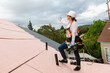 © ByLorena/Stocksy - Construction woman working on roof