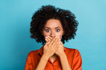 Portrait of worried nervous lady arms palms covering mouth mute quiet isolated on blue color background