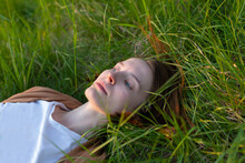 Girl Lies In The Grass
