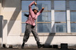 © Bo Bo/Stocksy - young woman hip hop dance on the roof