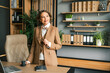 © velirina - Confident stylish mature middle aged elderly woman in office. General manager,ceo. Old senior businesswoman,60s lady in suit, executive business leader. Entrepreneur career.Accountant bank workplace