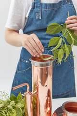 Woman working on oil distilling