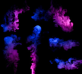Wall Mural - clouds of colorful neon blue and purple smoke puffs design elements isolated on black background