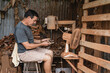 © Leonardo Borges/Stocksy - Carpenter working in his workshop.