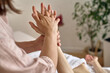 © Iuliia Versta/Stocksy - Woman receiving a hand massage