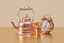 Old-fashioned Copper Kettle, Cups And Alarm Clock.