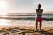 © Marco Govel/Stocksy - Fitness woman training on the beach