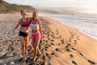 © Marco Govel/Stocksy - Two friends walking on the beach