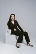 © ZQZ Studio/Stocksy - Portrait of young woman wearing suit