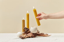 Natural Yellow Beeswax Candles Arranged By Woman.