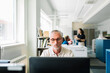 © Studio Firma/Stocksy - Middle-aged Man Working in Office