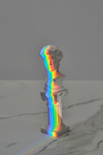 Antique Statue Head Covered In Rainbow.