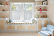 © Trinette Reed/Stocksy - Window seat in child's luxury bedroom