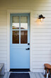 © Trinette Reed/Stocksy - Front door on farmhouse