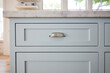 © Trinette Reed/Stocksy - Close-up of shaker cabinet in modern farmhouse kitchen
